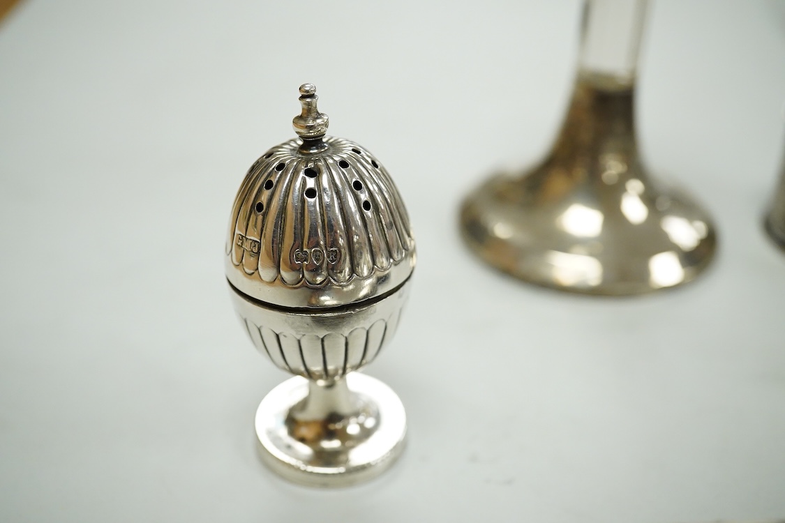 A collection of assorted small silver, including set of six 1930's coffee spoons, a mounted travelling pocket watch case, Victorian pepperette, mounted glass dwarf candlestick, enamelled powder box, Georgian stilton scoo